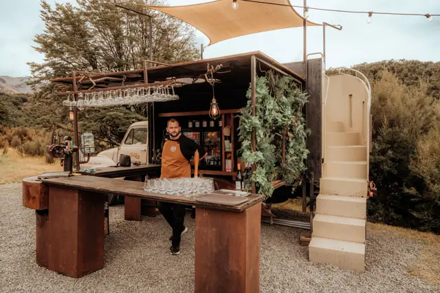 Bar truck dressed for a wedding with stairs to the rooftop